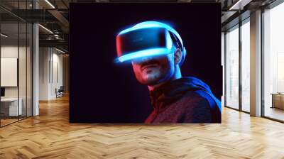 Model young man with beard in glasses of virtual reality on dark background.. Augmented reality, science, future technology concept. VR. Futuristic 3d glasses with virtual projection. Neon light. Wall mural