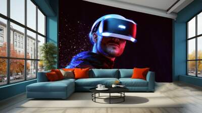 Model young man with beard in glasses of virtual reality on dark background.. Augmented reality, science, future technology concept. VR. Futuristic 3d glasses with virtual projection. Neon light. Wall mural