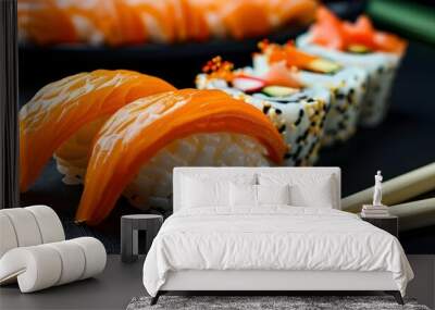 Chopsticks holding salmon nigiri sushi in a Japanese restaurant setting on a sleek black background Wall mural