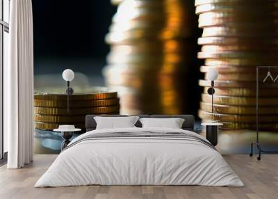 Close-up of stacked coins symbolizing financial growth and investment trends in a dynamic market landscape Wall mural