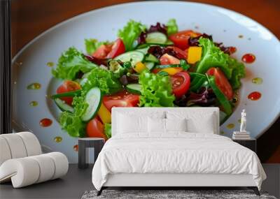 Colorful salad creation featuring fresh lettuce, tomatoes, cucumbers, and bell peppers elegantly presented on a white plate by a skilled waiter Wall mural