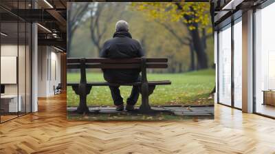 Contemplative solitude on a park bench surrounded by nature Wall mural