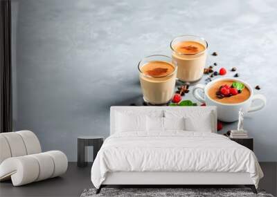 Creamy coffee duo adorned with herbs and berries on a textured gray surface, exuding brightness and freshness for the perfect morning boost Wall mural