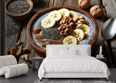 Delicious chia pudding topped with banana slices, walnuts, and a sprinkle of cinnamon on a rustic wooden table Wall mural