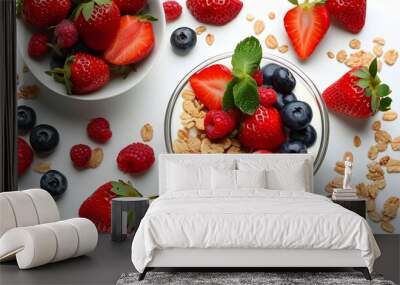 Delicious Homemade Yogurt with Fresh Strawberries, Berries, and Crunchy Cereals Over a Clean White Background Wall mural