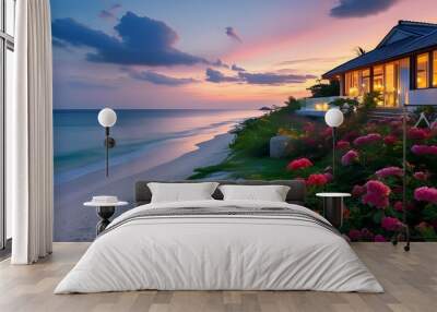 Dusk at a tranquil beach house adorned with colorful flowers and sparkling lights, offering a breathtaking view of the serene ocean and sandy shore Wall mural