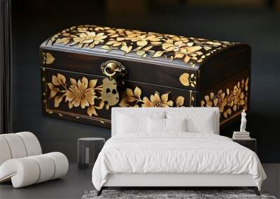 Elegant antique wooden box adorned with intricate floral carvings and a brass lock, featuring a rich dark finish complemented by shimmering gold accents Wall mural