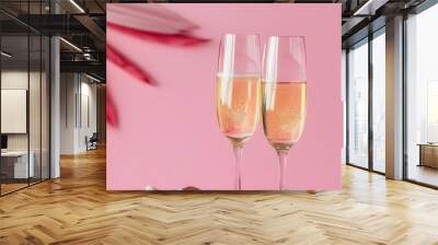 Elegant champagne glasses with cocktails on a whimsical pink background, ideal for Valentines Day, weddings, birthdays, and Womens Day celebrations in a retro 90s style Wall mural