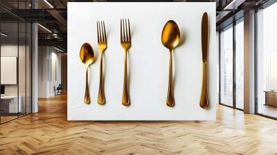 Elegant golden cutlery arrangement on white backdrop for festive dining celebration, ideal for holiday meal inspiration and decorative table designs Wall mural