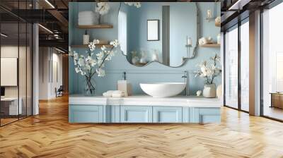 Elegant pastel blue bathroom decor with soft lighting, a mirror, white flowers, and stylish accessories on a white wood shelf Wall mural