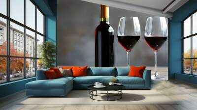 Elegant setting featuring a bottle of red wine with two gracefully filled glasses inviting a cozy evening. Wall mural