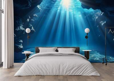 Enchanting deep blue underwater paradise illuminated by radiant light, showcasing clear waters and mesmerizing ripples Wall mural