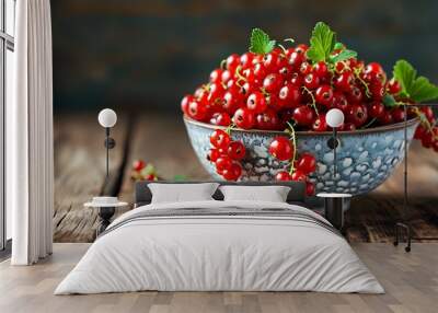 Freshly harvested red currants in a rustic bowl on a wooden table, showcasing organic summer produce with ample copy space Wall mural