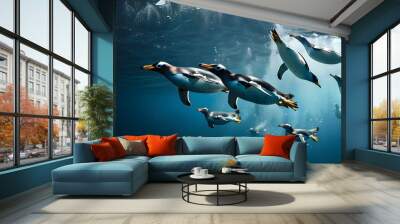 Gentoo penguins diving gracefully into the Atlantic ocean waters Wall mural