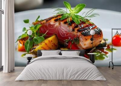 Gourmet grilled tuna served with roasted vegetables and fresh herbs on an elegant white plate Wall mural