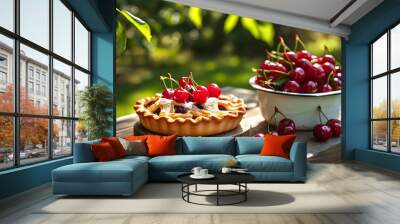 Homemade cherry pie on a wooden table in a sunny garden, celebrating summer treats and outdoor picnics with a delightful fruit pastry backdrop. Wall mural