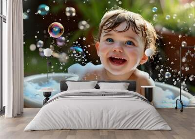 Joyful baby with sparkling blue eyes reveling in a bubble bath, surrounded by fluffy bubbles, splashing water and beaming with delight. Wall mural