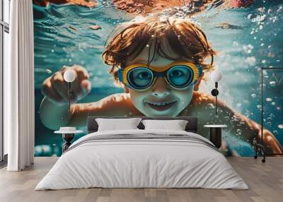 Joyful underwater adventures of a young boy with goggles, embracing the fun of summer vacation in a swimming pool Wall mural