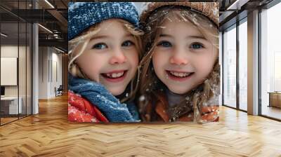 Joyful winter playtime of two little friends in a snowy wonderland Wall mural