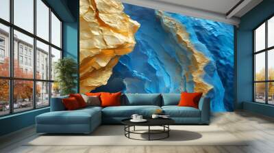 Mesmerizing interplay of golden rock textures and shimmering blue water in an abstract vista Wall mural