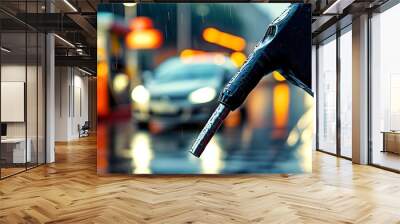 Refueling a car on a rainy day with a blurred background emphasizing the fuel nozzle and transportation concept Wall mural