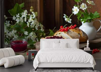 Rustic bread paired with berry jam in a cozy wooden kitchen surrounded by flowers and vibrant red currants Wall mural