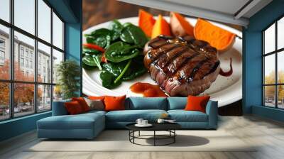 Savory grilled steak accompanied by roasted sweet potatoes and sautéed spinach on an elegant white plate Wall mural