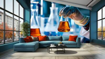 Scientists Gloved Hand Cradles Conical Flask of Amber Liquid in a Bright Laboratory Setting Wall mural