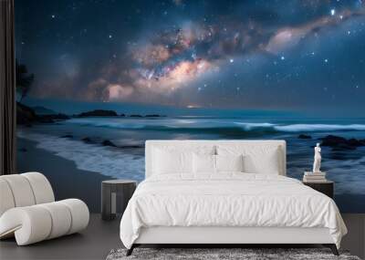 Serene beach under a starry night sky featuring the Milky Way and gentle ocean waves Wall mural