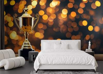 Shimmering golden trophy cup resting on a wooden table with a dreamy bokeh backdrop, embodying triumph and accomplishment Wall mural