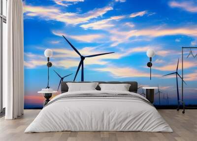 Silhouetted windmills at dusk, symbolizing sustainable energy and a greener future against a vibrant sky Wall mural