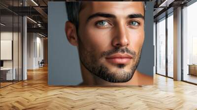 Striking portrait of a mans face showcasing radiant skin and captivating eyes on a grey studio background for dermatology skincare highlights. Wall mural