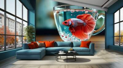 Surreal aquatic scene of a vibrant betta fish gliding gracefully in a transparent coffee cup Wall mural