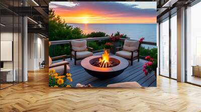 Tranquil sunset over the ocean from a cozy patio, with a fire pit, inviting chairs, and colorful flowers inviting relaxation Wall mural