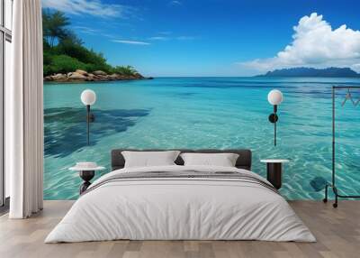 Tranquil tropical beach with crystal-clear blue waters Wall mural