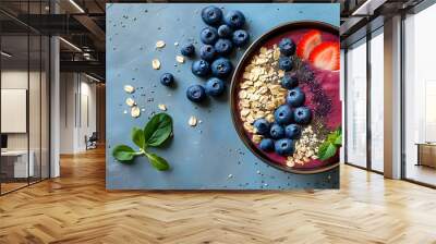 Vibrant acai berry smoothie bowl adorned with fresh blueberries, crunchy granola, and chia seeds, perfect for a healthy springtime breakfast or snack Wall mural