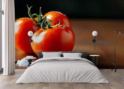 Vibrant red tomatoes seasoned with salt and pepper on a rustic table, celebrating fresh ingredients for healthy eating Wall mural