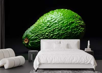 Vibrant ripe avocado showcasing textured green skin against a sleek black backdrop Wall mural