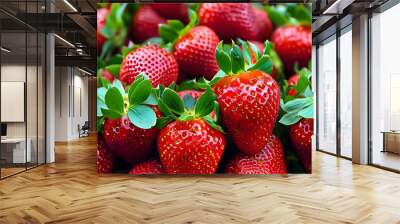 Vibrant strawberries piled high, displaying juicy red hues and lush green leaves, ideal for summer culinary creations Wall mural