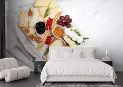 Cheese board with pecorino  brie goat cheese with crackers and grissini breadsticks  figs jam olives and berries Wall mural