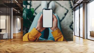 Mockup woman's hand holding using smart phone with white blank screen POV  at coffee shop, mobile app design and advertising, online marketing Wall mural