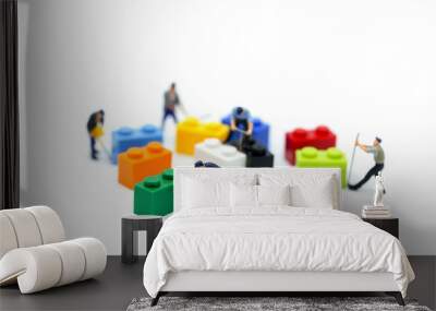 miniature people : worker with colorful kids toys. Wall mural