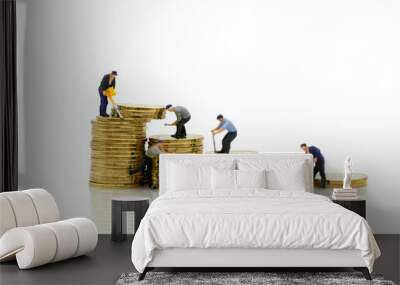 Miniature people : workers with stack of coins. Wall mural