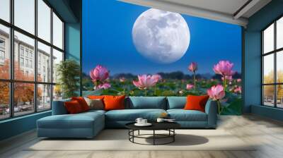 the full moon hangs high in the sky and pink lotus flowers bloom on green leaves by nightfall pink petals dance gracefully with soft lighting Wall mural