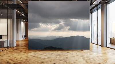 Mountains silhouette and sun rays Wall mural