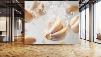 Garlic cloves floating, steaming, white background, cooking, food photography Wall mural