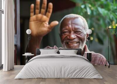 African old man waving his hand to say hello and greet Wall mural