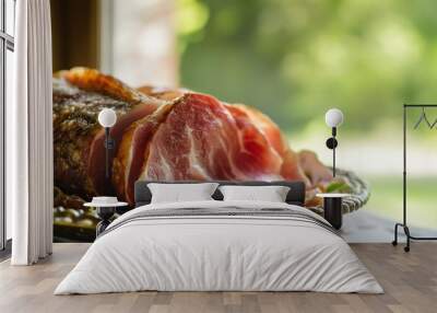 Close-up of Delicious Prosciutto Slices on a Gold Plate with Nature Background Wall mural