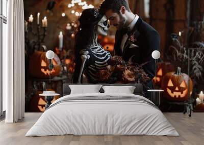 A spooky Halloween-themed wedding with the bride in a black gown holding a bouquet of dark roses and the groom in a skeleton suit, surrounded by jack o lanterns and candles Wall mural