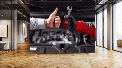 Anonymous man approving job of auto mechanic in workshop Wall mural